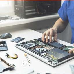 Technician servicing a laptop